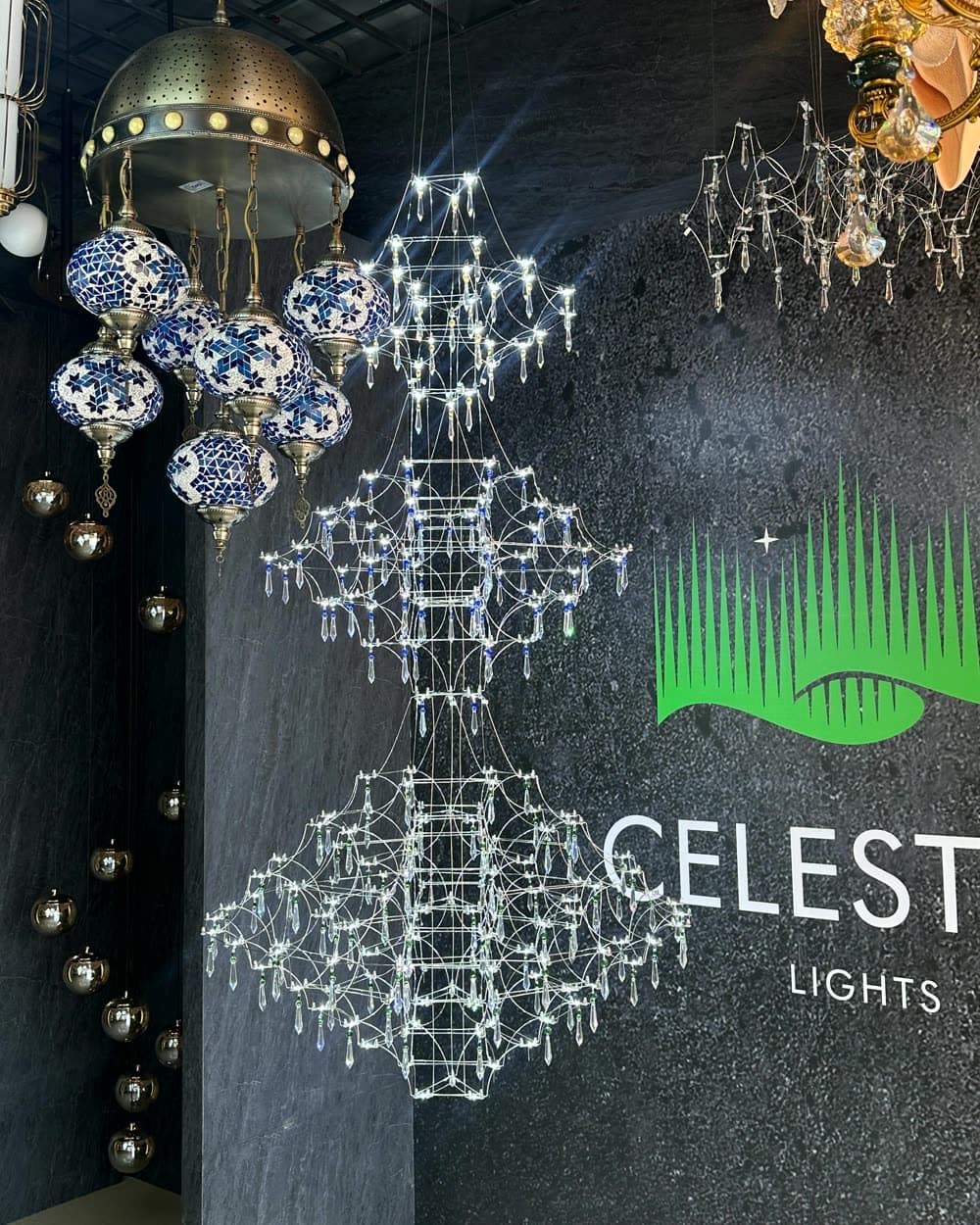 Inside a Celestial Lights store, a wall of lit fixtures